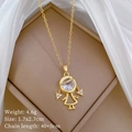 Macro view of gold girl pendant with large zircon and weight details on silk background - Braided Girl Style (B120)