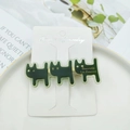 Detailed close-up of dark green acetate cat hair clip with golden Barrette La France text - Dark Green