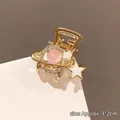 Molla per capelli a pianeta dorata con perla rosa e stelle, circa 3x2cm - Pianeta Rosa