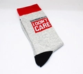 Grey cotton crew socks with red cuff and BREAKING NEWS I DON'T CARE slogan print - One Size / Humorous Slogan Style (J001)