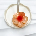 Gradient orange-red flower claw clip on a white cloud jewelry tray for women - Orange Base Red Center (Rolled Flower)