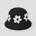 Detail of handmade crochet bucket hat featuring three 3D white flowers on black yarn - Black