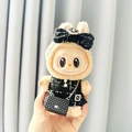Labubu plush doll wearing a black elegant tweed outfit with a large bow headband - Black Camellia Pendant With A Subtle Fragrance + Small C Bag / First And Second Generation Keychains Are Compatible With La Cloth Dolls. Dolls Not Included.