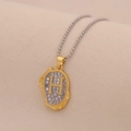 Close-up of golden letter H pendant necklace with sparkling diamonds on a bead chain - Letter H