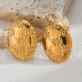Macro detail of vintage oval gold earrings with floral relief on white rock - Oval Floral Relief Style (E792)