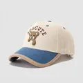 Detail of waffle-textured cotton fabric on kids baseball cap with brown bear embroidery - Off White