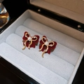 Detail of red flocked bow earrings with gold trim, pearl center, and sparkling rhinestones - Flocked Bow Pearl Style (39#) / Dark Red