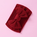 Close-up of red knitted waffle texture baby headband with a large decorative bow - Red-Bow