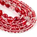 Macro detail of red and clear translucent round beads with inner striped texture - Red Flash Stone