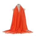 Detail view of vibrant orange cashmere-feel fringed scarf shawl for autumn winter warm wear. - Orange