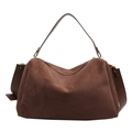 Brown suede pillow bag with leather handle and golden hardware on white background - Coffee