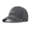 Washed grey cotton baseball cap with white Groom embroidery shown from 45-degree angle - Adjustable / Black
