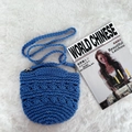 Close-up of blue handmade crochet shoulder bag showing intricate woven cotton rope texture - Blue
