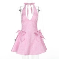 Dettaglio ravvicinato dell'abito rosa in pizzo jacquard con fiocchi decorativi - XS / Rosa