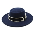 Detail of navy wool felt boater hat featuring black grosgrain ribbon and white bead trim - Navy Blue