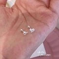 Silver rocking horse screw back stud earrings displayed on a hand for scale - Rocking Horse Shape Style (A314)
