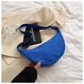 Detail of Klein blue nylon crescent bag with adjustable wide strap on white fabric - Blue