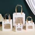 White smiley gift bag with clear window and handles in four various sizes - S: 10x10x10cm / White Window