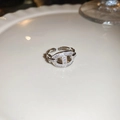 Detail of silver pig nose chain ring with pavé zircons on white plate display - 17# Ring - Silver Pig Nose