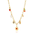 Gold necklace featuring fruit charms, pearls and heart pendant on white background - Gold Multi-Charm Style