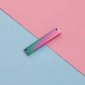 Macro view of rectangular rainbow plated stainless steel tag with double holes - 2*6*35mm / Rainbow