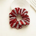 Close-up of red and silver striped metallic scrunchie with sparkling lurex texture - Christmas Striped Red