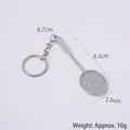 Miniature silver zinc alloy badminton racket keychain with detailed mesh and ring - Keychain style / Silver Badminton Racket