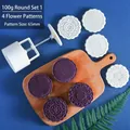Close-up of 100g mooncake press tool with four interchangeable 65mm floral pattern stamps - Round Set 1 (4 Patterns)