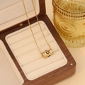 Gold stainless steel necklace with evil eye cylinder pendant in premium wooden jewelry box - Black