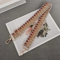 Close-up of woven bag strap with geometric patterns and golden metal swivel hooks - Khaki Brown + Gold Hook
