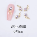 Detailed macro view of 6x9mm gold alloy horse-hoof flower nail charms with purple rhinestones - Gold Base Purple Rhinestone (AM85)
