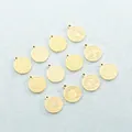Detail view of 12 gold stainless steel zodiac pendants with engraved signs and names - Etched Style - Gold - Aries / Gold