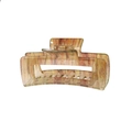 Macro detail of 10.5cm large hair claw clip with amber leopard print texture on white base - Translucent Pattern