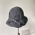 Detail of water-resistant black nylon sun hat with decorative silver metal buckles - Black