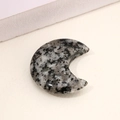 Polished moon-shaped natural stone ornament with grey and black spotted mineral texture - Granite Pattern