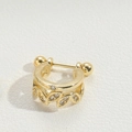 Gold leaf-shaped ear cuff with sparkling zircons on a beige textured leather base - Round Style