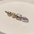 Detailed macro of gold hair clip featuring four colorful rhinestones in varied shapes - Style L (White Zircon Iridescent)