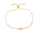 Macro detail of gold star bracelet featuring pavé zircon star and adjustable slider clasp - White