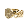 Close-up of gold plated ring with letter P design, heart detail and sparkling zircon - Letter P