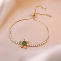 Adjustable gold snowflake bracelet with emerald green crystals on champagne silk - Emerald Snowflake Bracelet / Gold