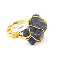 Detail shot showing the 18mm inner diameter measurement of the wire wrapped raw stone ring - Adjustable Open / Obsidian