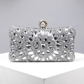 Detailed macro view of sparkling silver evening clutch with rhinestones and pearl clasp - Silver
