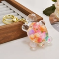 Transparent turtle keychain with colorful glitter and beads on golden ring accessory - Nocturnal Colorful 1