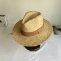 Close-up of the woven texture on a raffia straw hat with a brown decorative band - M (56-58cm) / Mocha Ribbon