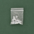 Transparent silicone earring backs in a clear resealable bag on green surface - Transparent Bullet Earring Stopper / 10 Pieces Pack