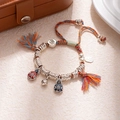 Macro detail of S925 silver charm with enamel craft on handmade woven bracelet - L312-4 Gold Beast Family