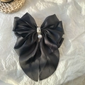 Elegant black ribbon bow hair clip with white pearls and pendant on white background - Black Pearl Satin Bow Hair Ornament / Black