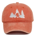 Close-up of Bigfoot embroidery and washed canvas texture on vintage baseball cap - Coral