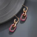 Gold tone geometric link earrings featuring fuchsia micro-pave zirconia crystals - Purple Diamond U-Link / Gold