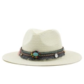 Detail of bohemian straw sun hat featuring ethnic colorful tassels and turquoise beads - Creamy White